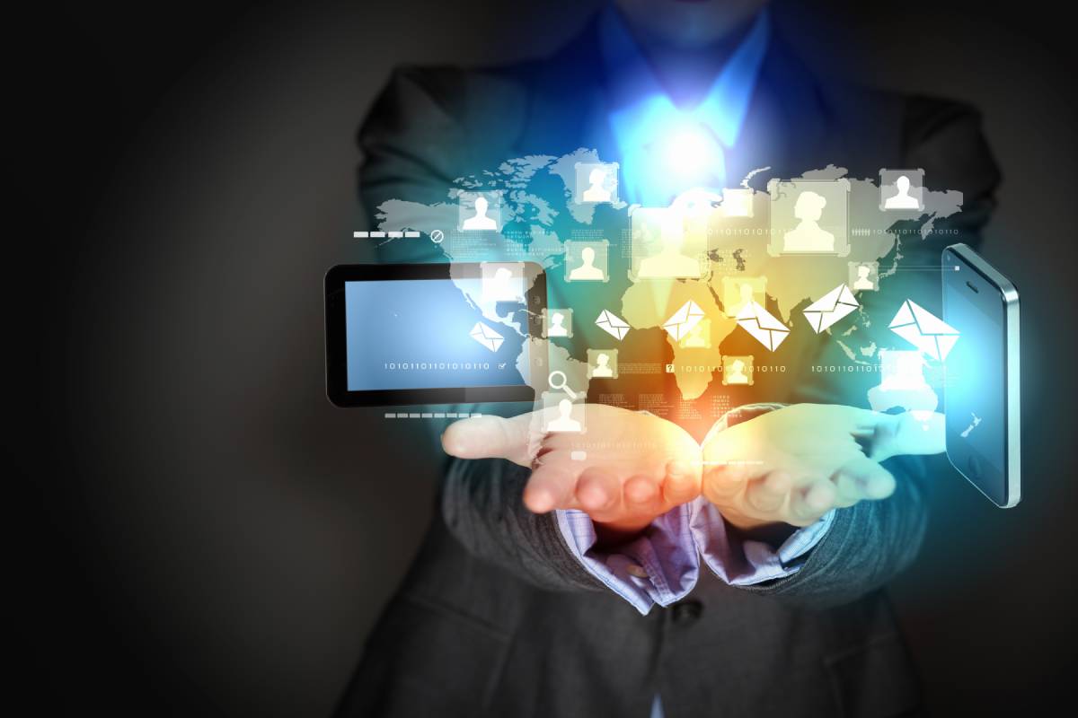 Man holding digital IT icons