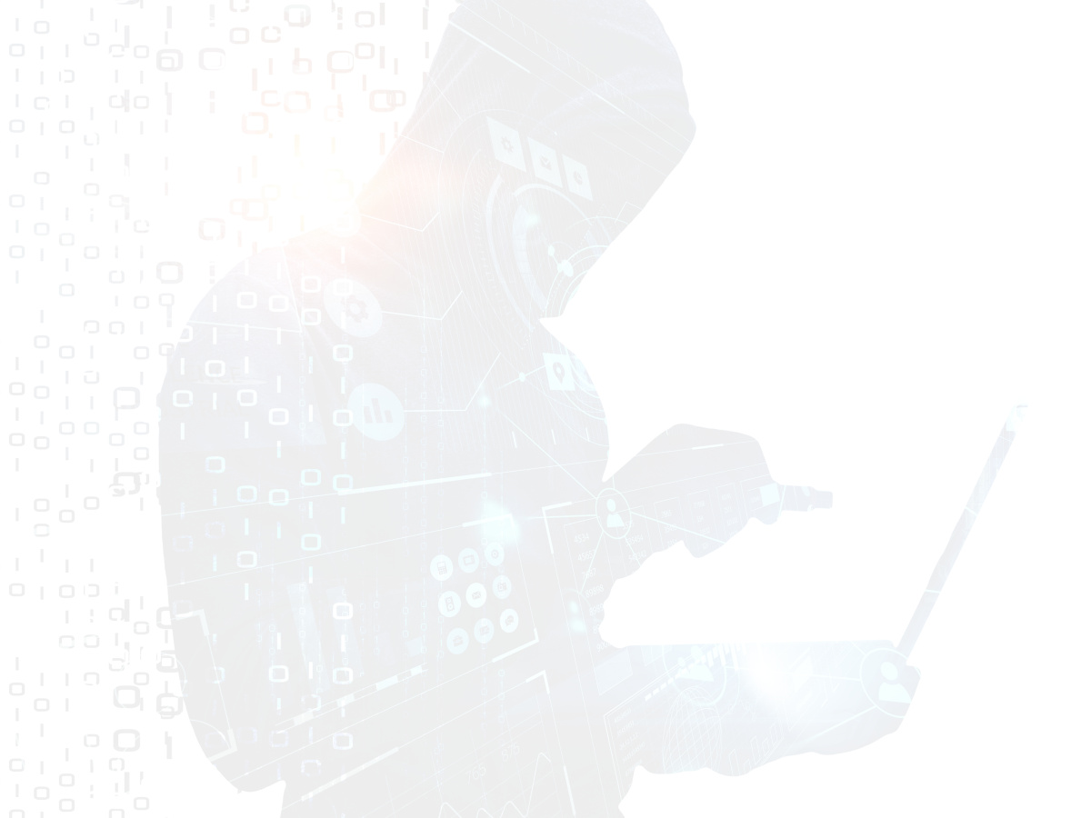 Hacker working in shadows