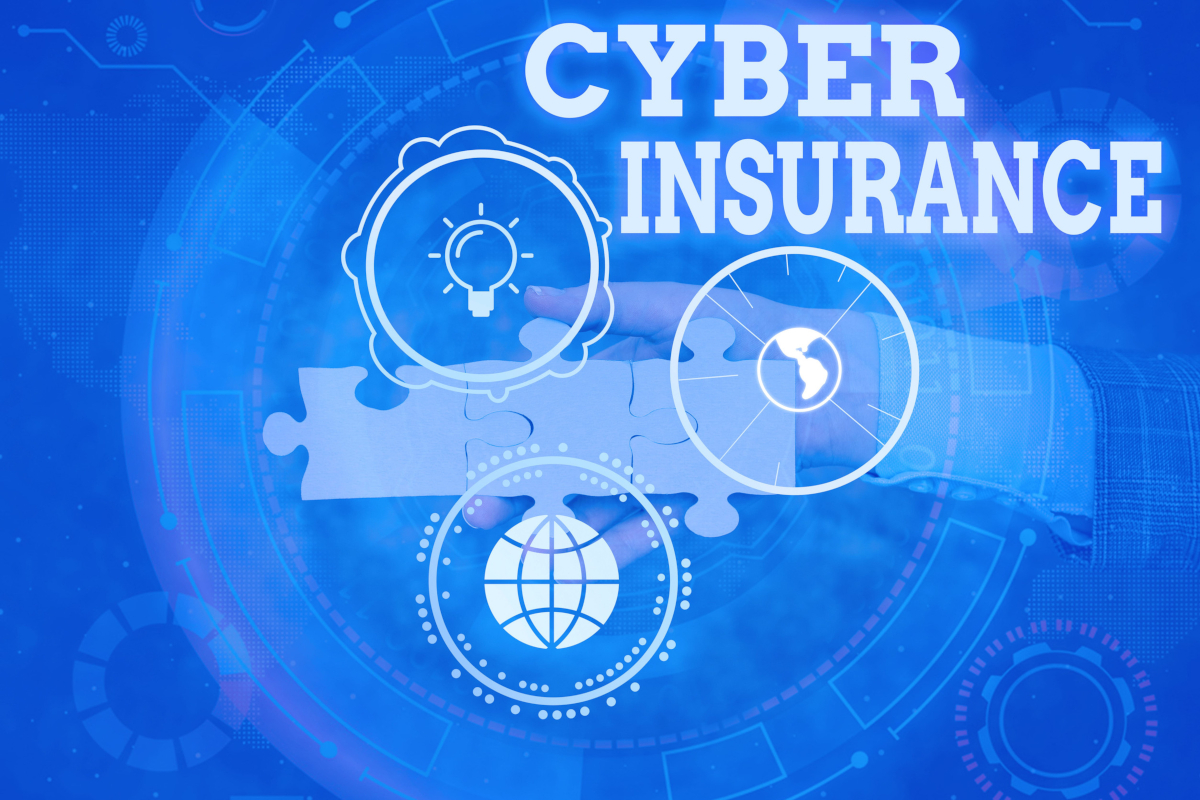A blue tech-themed graphic with the text CYBER INSURANCE next to floating circular icons representing an idea, a clock, and a globe over a hand holding puzzle pieces.