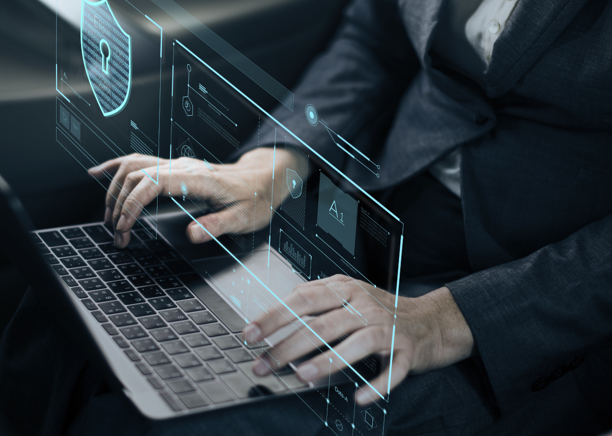 Man using a laptop that is digitally cyber protected
