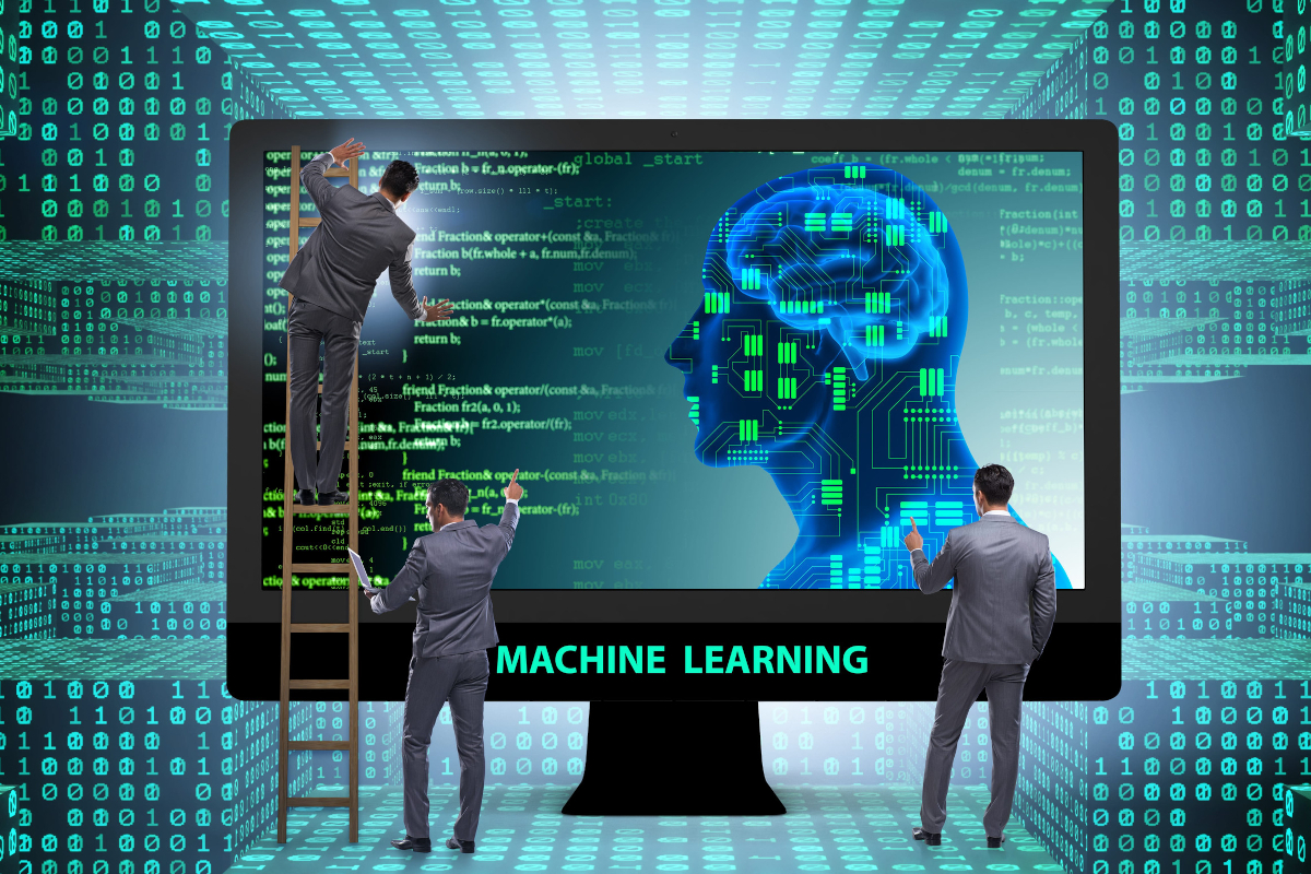 IT professionals examining a machine learning concept display.
